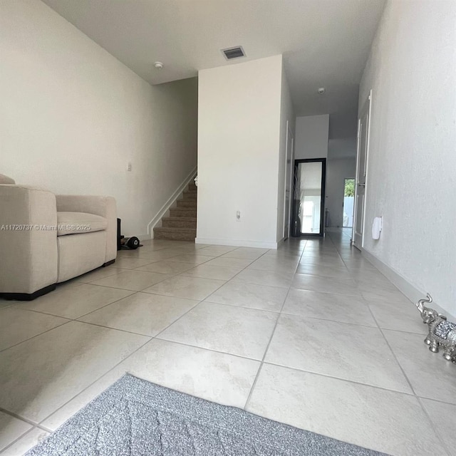 hallway featuring light tile patterned flooring