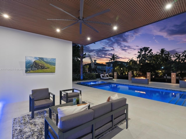 pool featuring a patio area, ceiling fan, and an outdoor hangout area