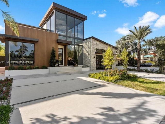 exterior space with stone siding