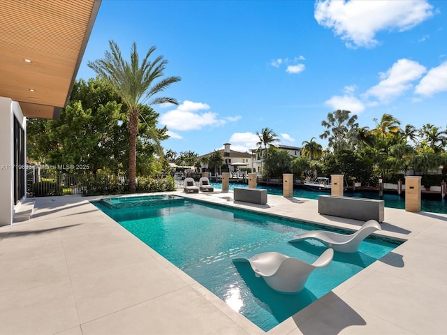 view of pool with a fenced in pool and a patio