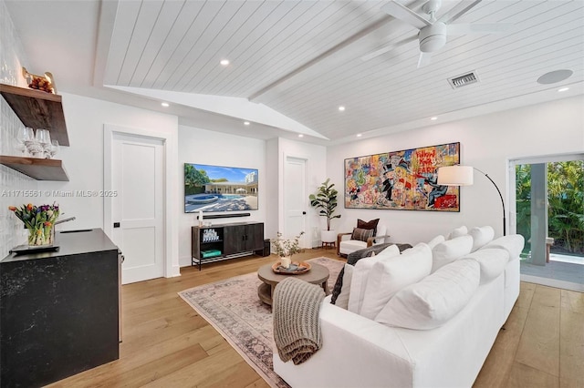 living room featuring vaulted ceiling with beams, ceiling fan, light hardwood / wood-style flooring, and wooden ceiling