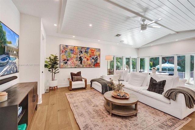 living room featuring ceiling fan, vaulted ceiling with beams, wooden ceiling, and light hardwood / wood-style floors