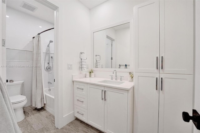 full bathroom with vanity, toilet, and shower / bath combo with shower curtain