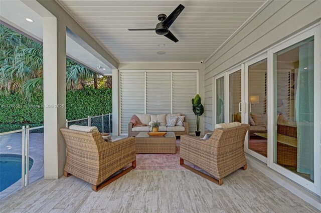 sunroom with ceiling fan