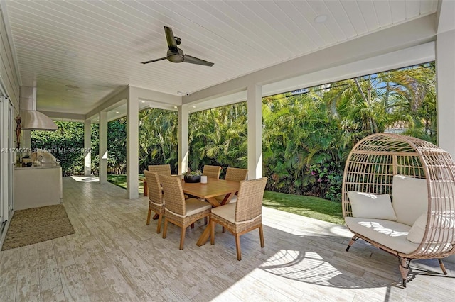 sunroom / solarium with ceiling fan