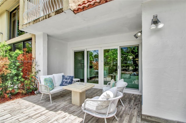 wooden terrace with outdoor lounge area