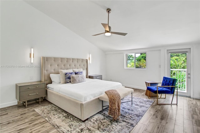 bedroom featuring access to outside, light hardwood / wood-style floors, ceiling fan, and lofted ceiling