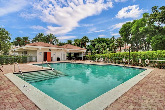 view of swimming pool with a patio