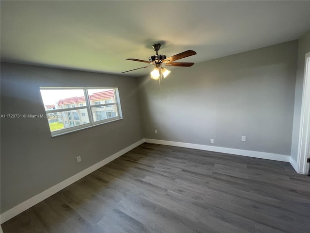 empty room featuring ceiling fan and hardwood / wood-style floors