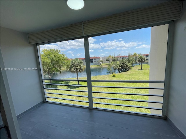 balcony featuring a water view