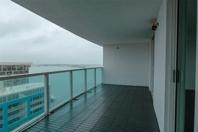 balcony featuring a water view