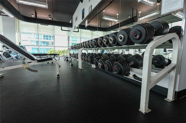 workout area with a wall of windows