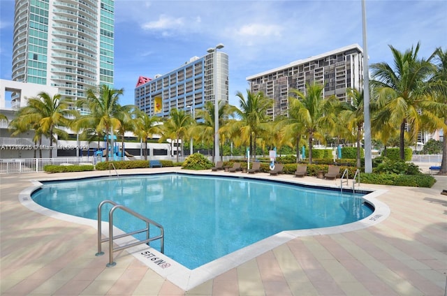 view of swimming pool with a patio area