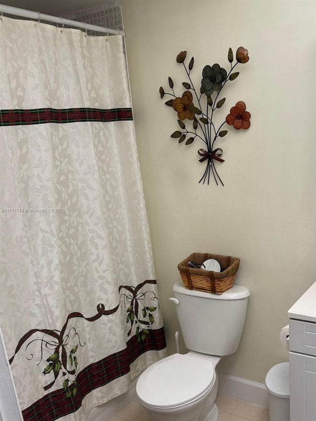 bathroom with tile patterned floors, vanity, and toilet