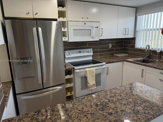 kitchen with white cabinetry, white appliances, sink, and tasteful backsplash