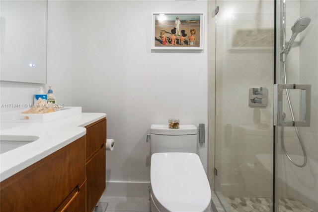 bathroom with a shower with door, toilet, and vanity