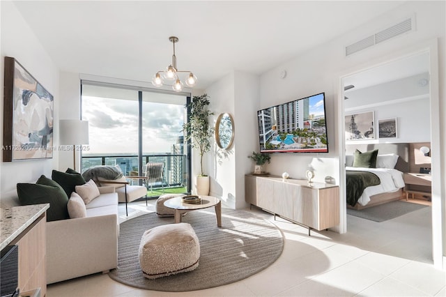 tiled living room featuring expansive windows and a notable chandelier