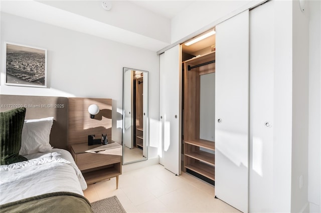 bedroom featuring light tile patterned flooring