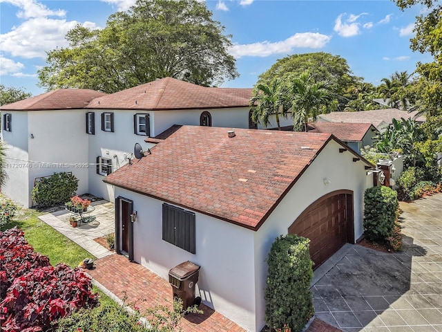 1524 39th St, West Palm Beach, FL 33407 - view of front of house featuring stucco siding and an attached garage