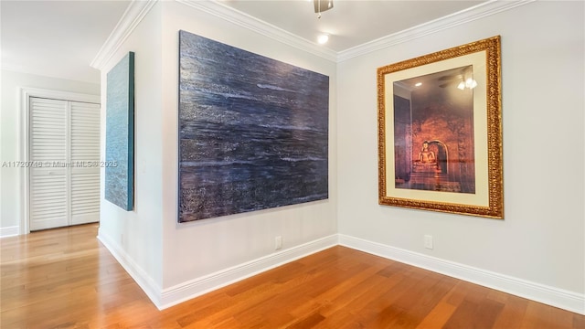 1524 39th St, West Palm Beach, FL 33407 - empty room with wood finished floors, baseboards, and crown molding