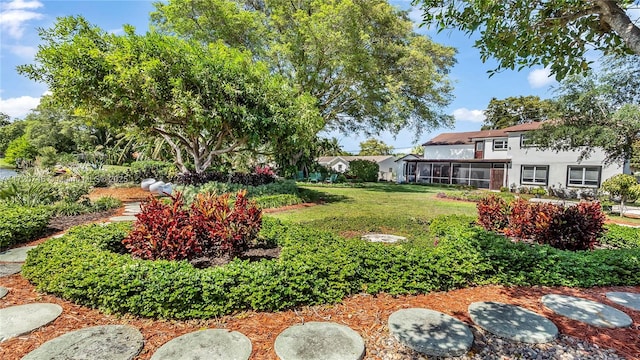 1524 39th St, West Palm Beach, FL 33407 - view of grassy yard featuring a sunroom