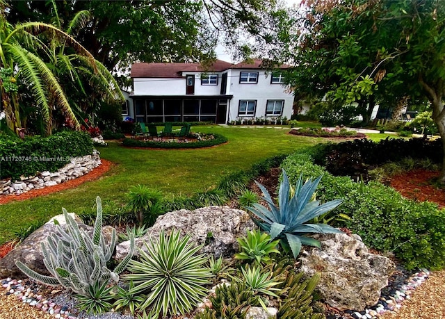 1524 39th St, West Palm Beach, FL 33407 - view of grassy yard with a sunroom