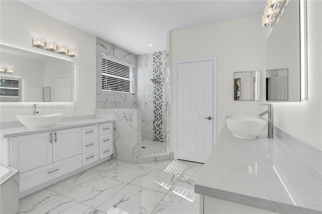 bathroom with vanity and tiled shower