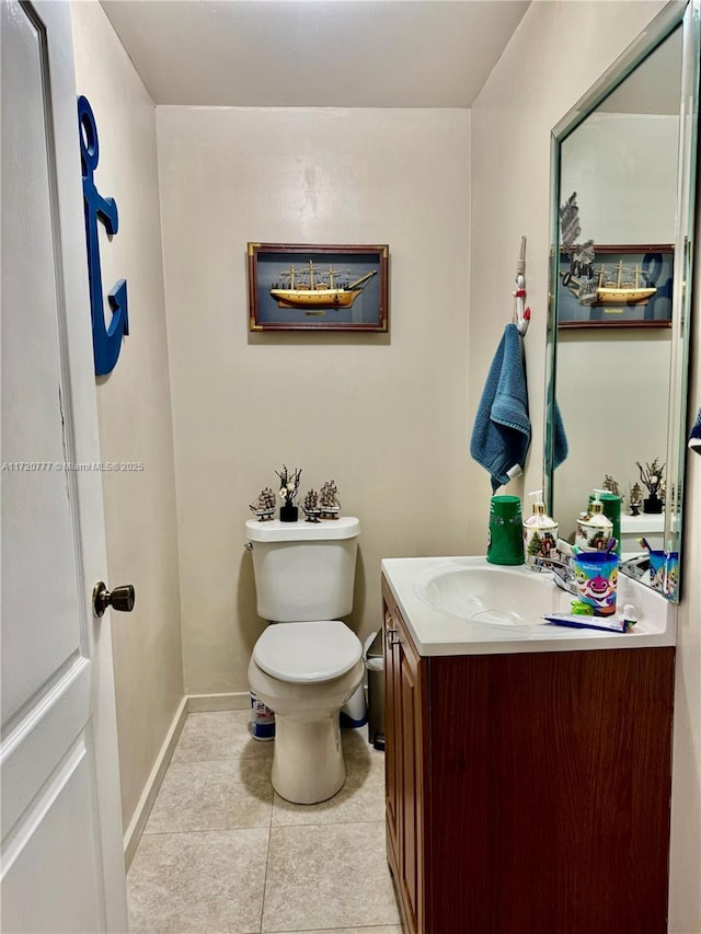 bathroom featuring tile patterned floors, vanity, and toilet