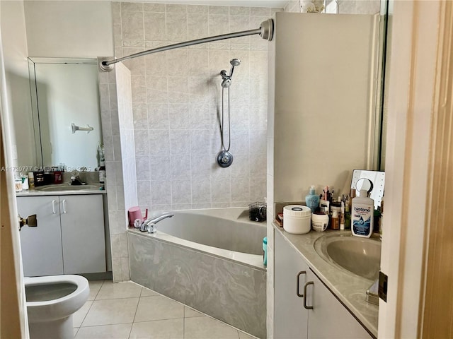 bathroom featuring tile patterned floors, vanity, and tiled shower / bath combo