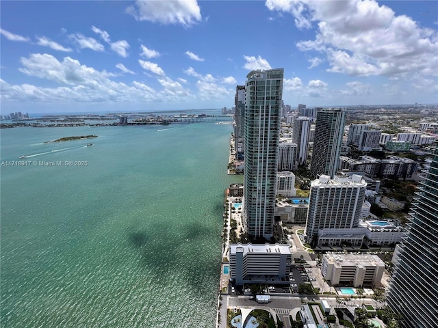 aerial view featuring a city view and a water view