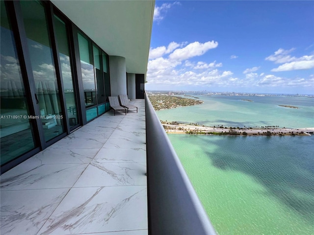 balcony featuring a water view