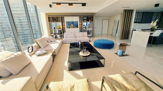 living room featuring beverage cooler and a wealth of natural light