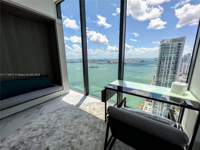 balcony featuring a view of city and a water view