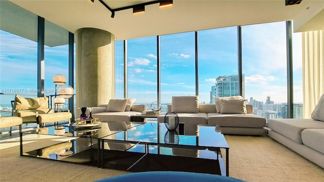 living area with a view of city and floor to ceiling windows