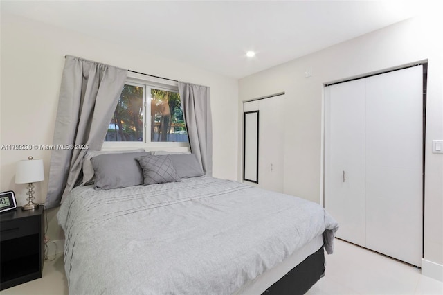 bedroom featuring multiple closets