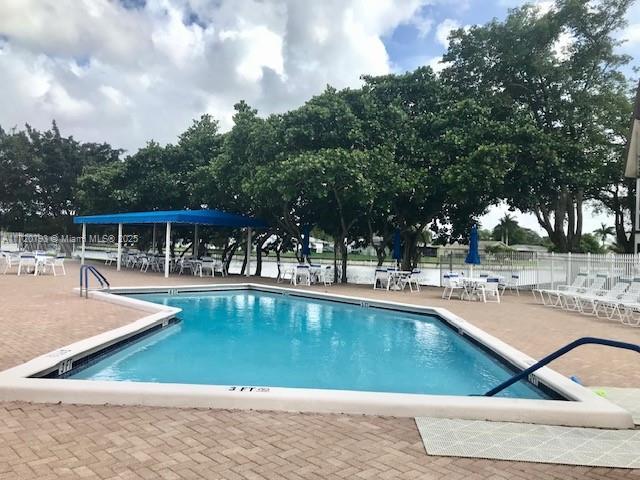 view of swimming pool with a patio area