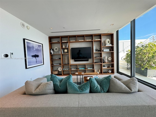 living room with floor to ceiling windows