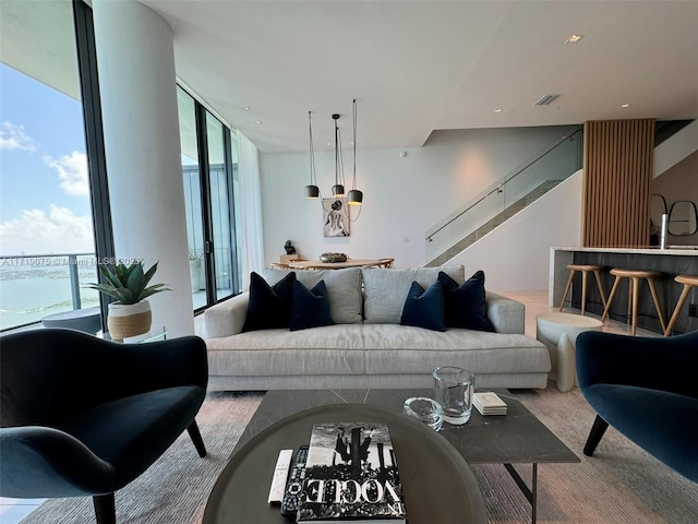 living room with floor to ceiling windows