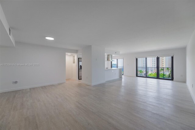 unfurnished room featuring light hardwood / wood-style flooring