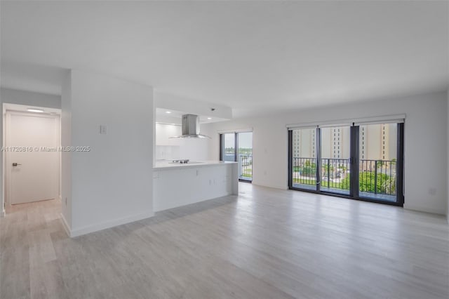 unfurnished living room featuring light hardwood / wood-style flooring