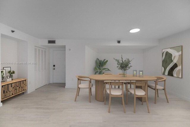 dining room with light hardwood / wood-style flooring