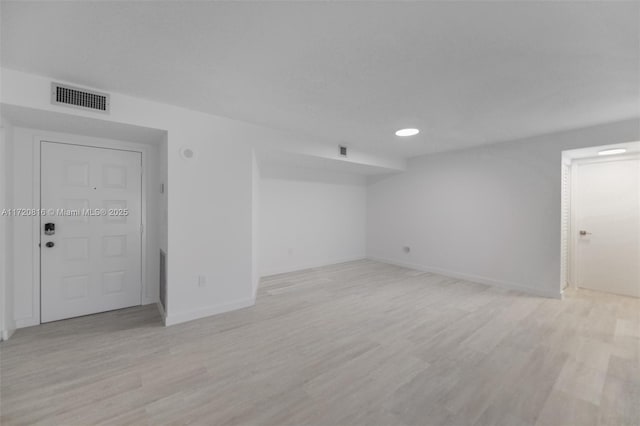 unfurnished room with light hardwood / wood-style flooring