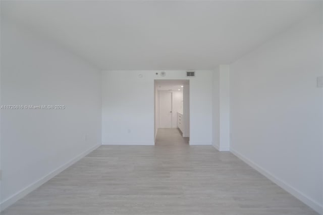 unfurnished room featuring light wood-type flooring