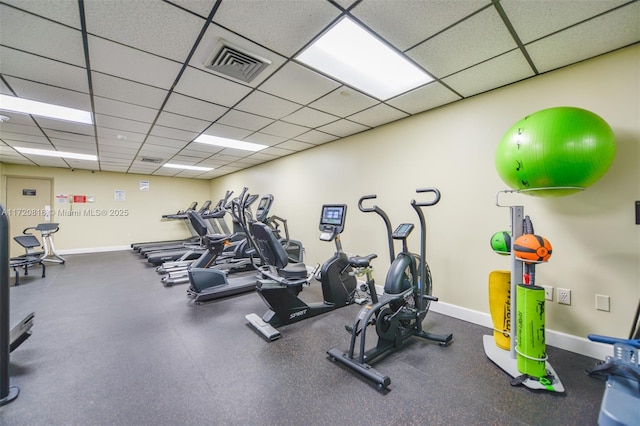 exercise room featuring a drop ceiling