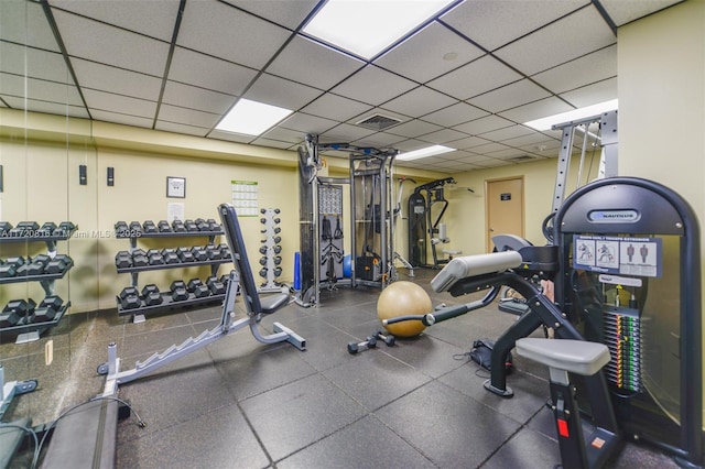 workout area featuring a drop ceiling