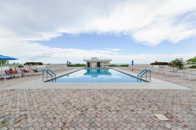 view of swimming pool with a patio