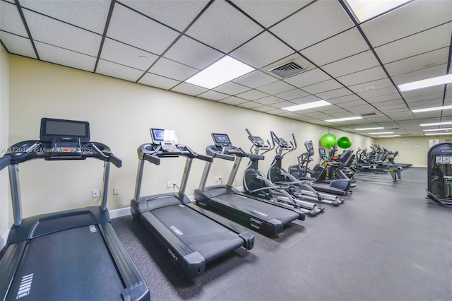 exercise room with a drop ceiling