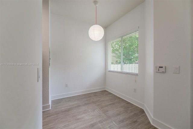 unfurnished room with light wood-type flooring