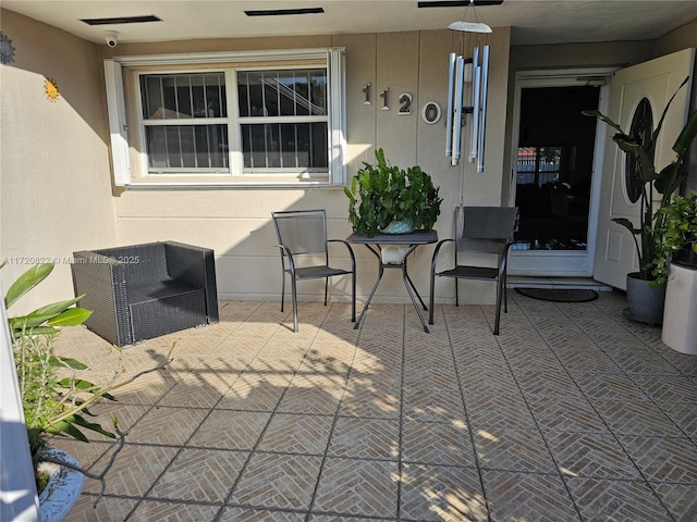 view of patio / terrace featuring ceiling fan