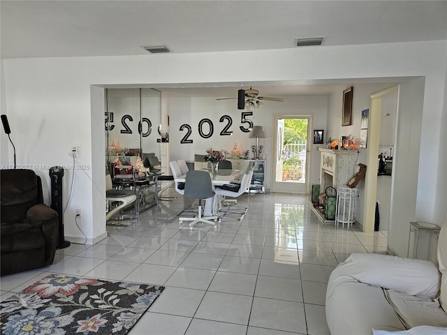 tiled dining room featuring ceiling fan